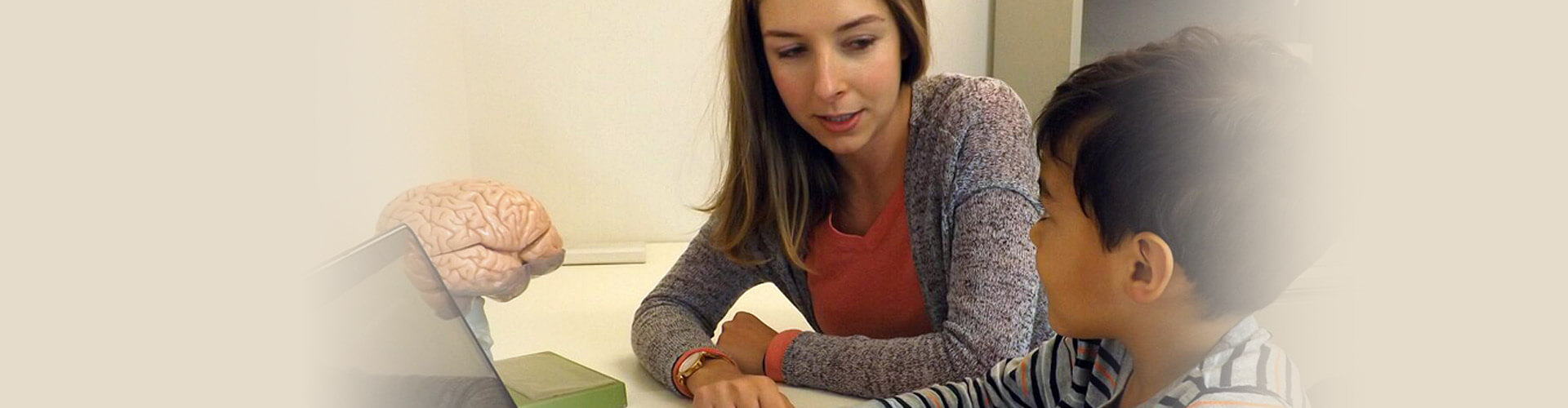 researcher and child at computer